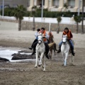 Carrera de caballos y burros