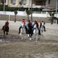 Carrera de caballos y burros