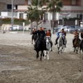 Carrera de caballos y burros