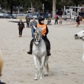 Carrera de caballos y burros